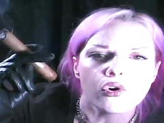 Annie vox cigar with pink hair.