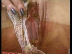 Skinny mature fingers her wet pussy