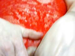 The wife dressed up playing with her toy